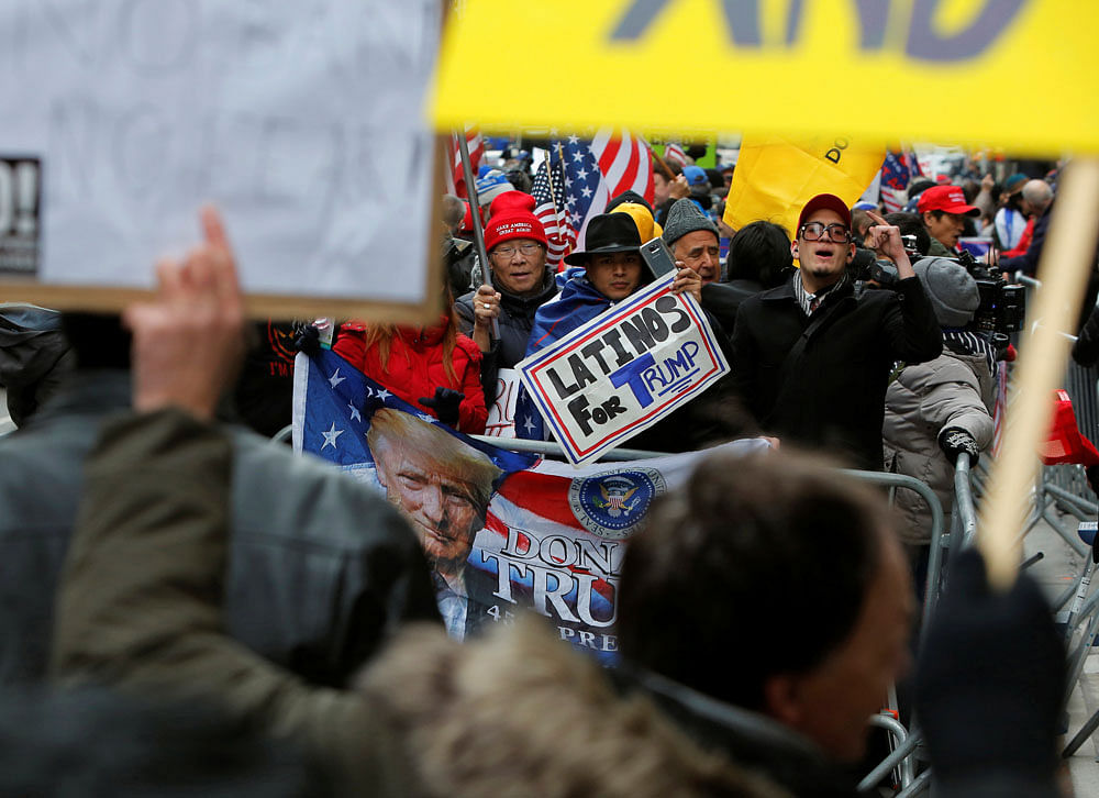 Supporters of U.S. President Donald Trump yell at anti-Trump protesters during a rally in support of Trump at Trump Tower in Manhattan, New York, U.S., February 5, 2017. REUTERS