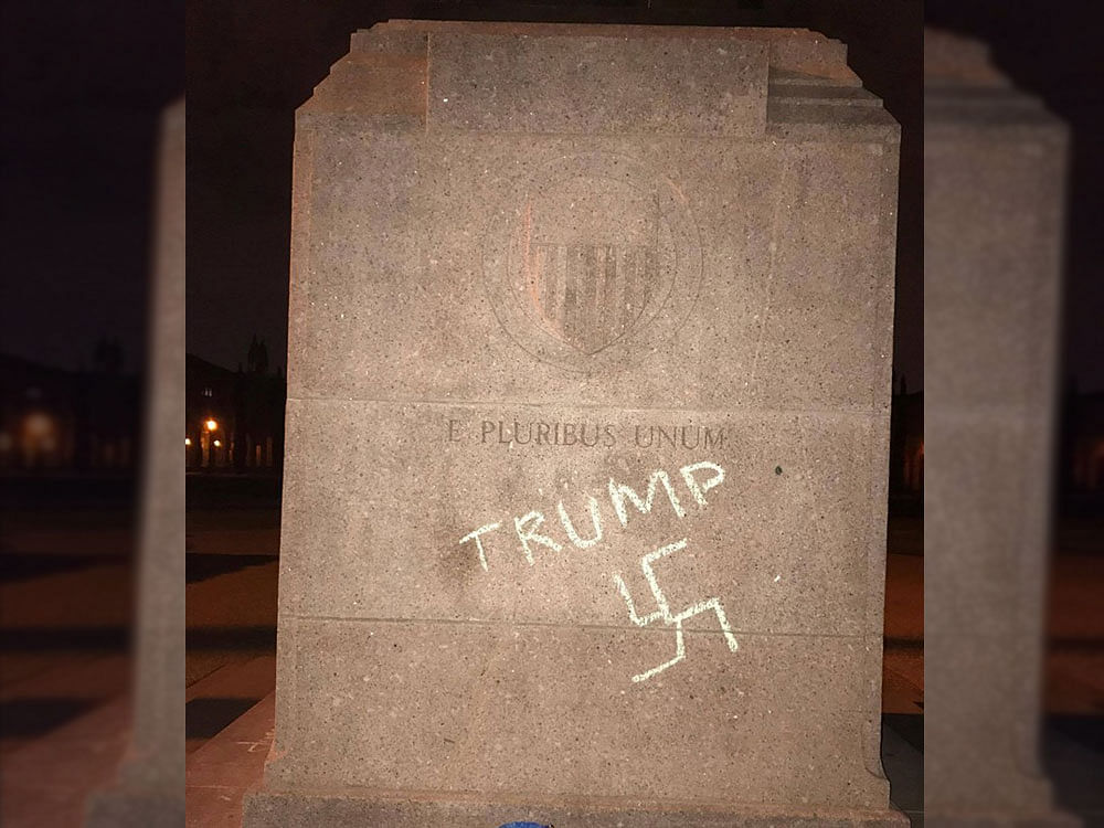 The Nazi symbol was drawn on the base of the founder William Marsh Rice's 2,000-pound statue in the heart of the Academic Quad lawn at Rice University, the Houston Chronicle reported. Courtesy: Facebook/The Rice Thresher