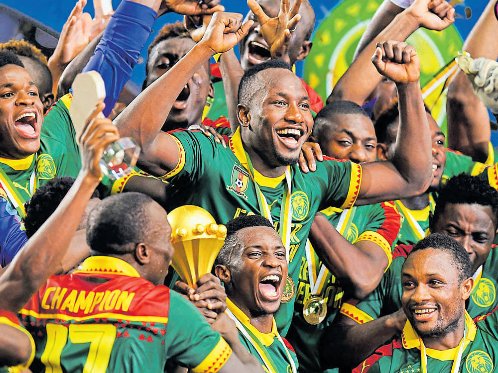 Sheer Delight: Cameroon players celebrate after their thrilling 2-1 triumph over Egypt in the final of the African Cup of Nations on Sunday.  AFP