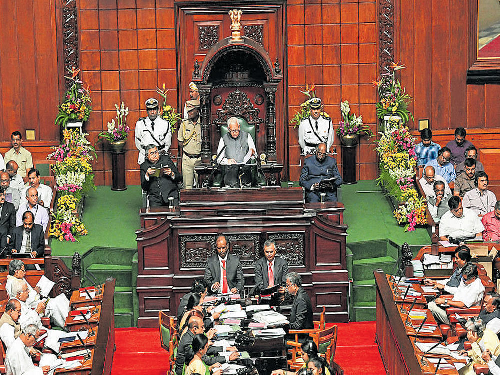 Governor Vajubhai Vala addresses the joint session of the legislature at the Vidhana Soudha in Bengaluru on Monday.  dh photo