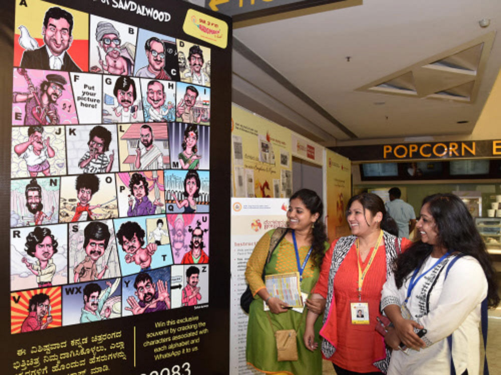 Visitors look  film stars poster at 4th day at Bengaluru International Film Festival (Biffes) organised by Information Department and Karnataka Chalanachitra Academy at PVR cinemas Orion Mall in Bengaluru on Monday. DH Photo.