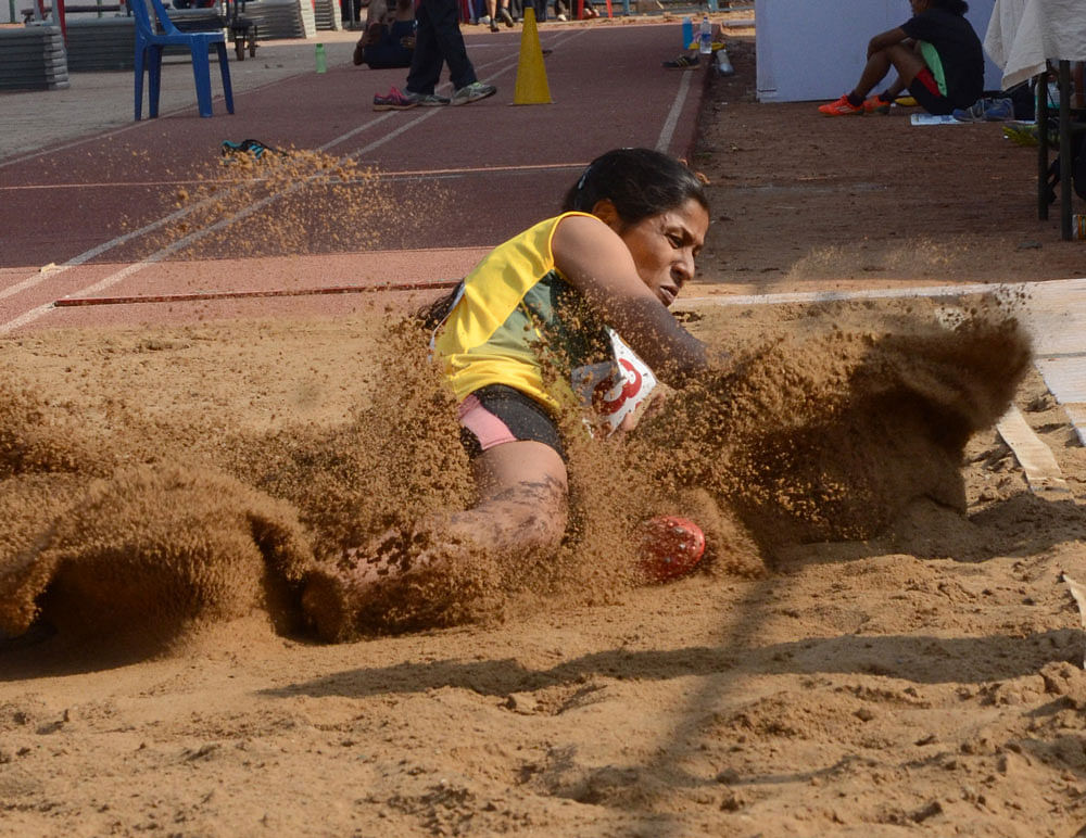 Fine effort: Sneha SS&#8200;of Dakshina Kannada en route to her gold in the long jump on&#8200;Wednesday. DH photo