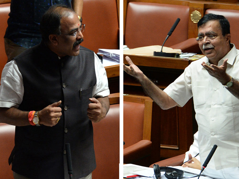 Aravind Limbavali (BJP) argues with Congress member K N Rajanna over demonetisation in the Legislative  Assembly on Wednesday. DH photos