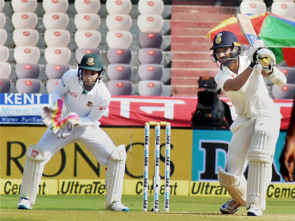 Indian Cricketer Ajinkya Rahane plays a shot in a match against Bangladesh at Uppal Stadium in Hyderabad on Friday. PTI Photo