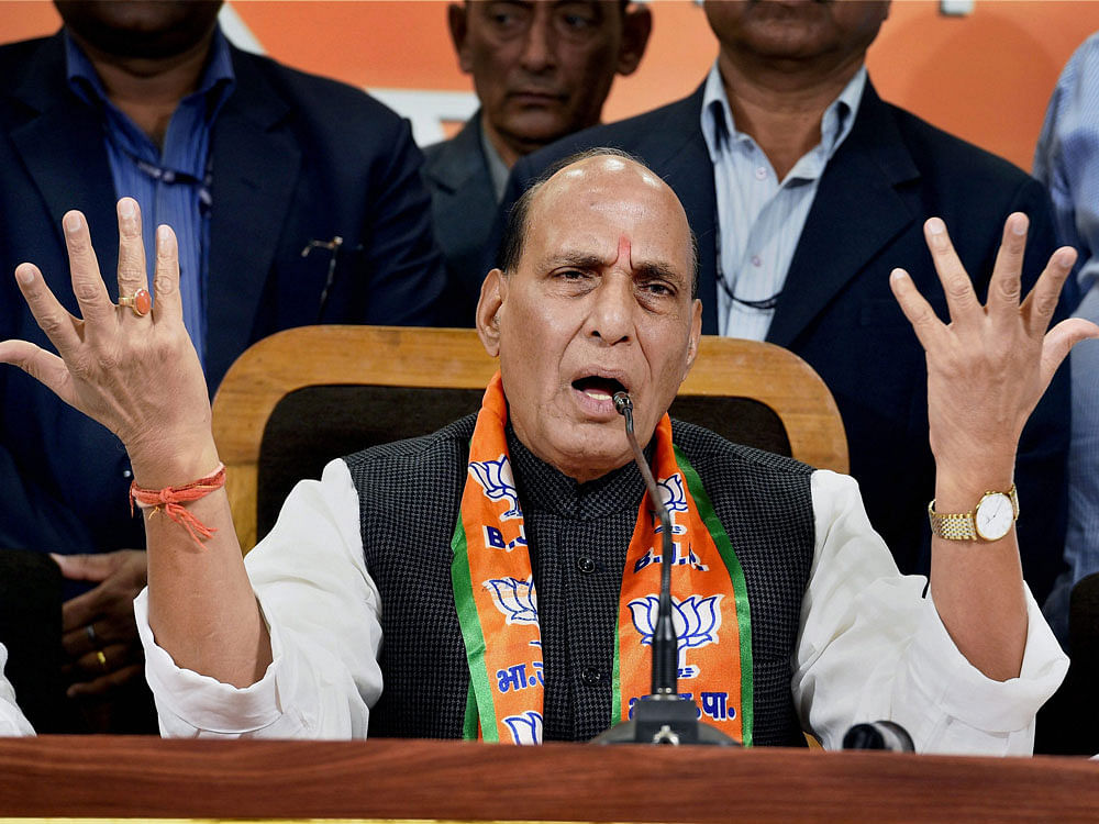 Home Minister Rajnath Singh addesses a press conference at party headquarters in Lucknow on Friday. PTI Photo