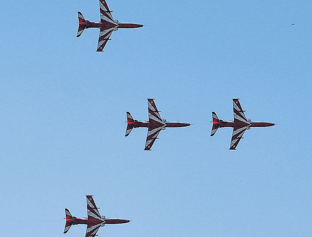 The Surya Kiran aerobatic team flies with Advanced Jet Trainer Hawk in flight formation during the rehearsal for Aero India 2017 at the Yelahanka Air Force Station on Friday.