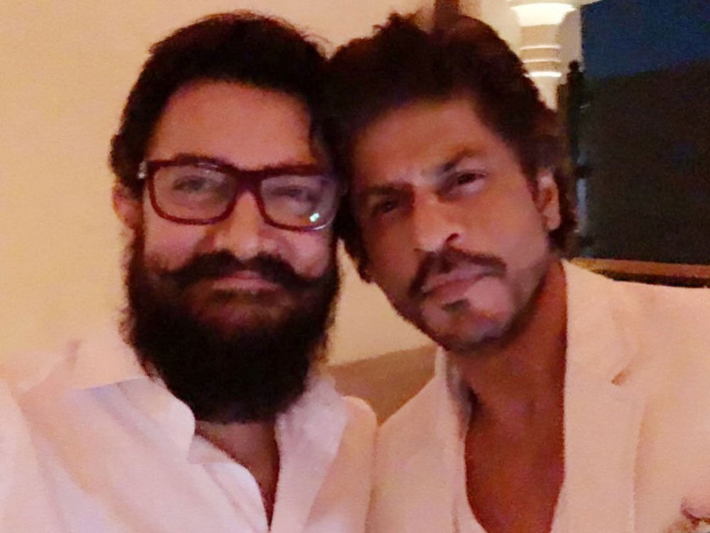 Shah Rukh, 51, who is mostly clicked hanging out with good friend Salman Khan, took to Twitter to share buddy selfie with the 'Dangal' star. Image source twitter