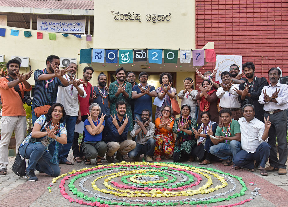 Members of Venkatappa Art Gallery Forum (VAG Forum) gather to celebrate completion of one year of their protest, save Venkatappa Art Gallery against privatisation, in front of Gallery, Kasturba road in Bengaluru on Monday. Photo