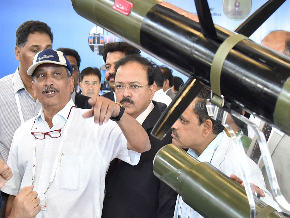 Defence Minister Manohar Parrikar at an exhibition during the inauguration of 11th edition of Aero India 2017 at Yelahanka Airbase in Bengaluru on Tuesday. DH Photo BK Janardhan