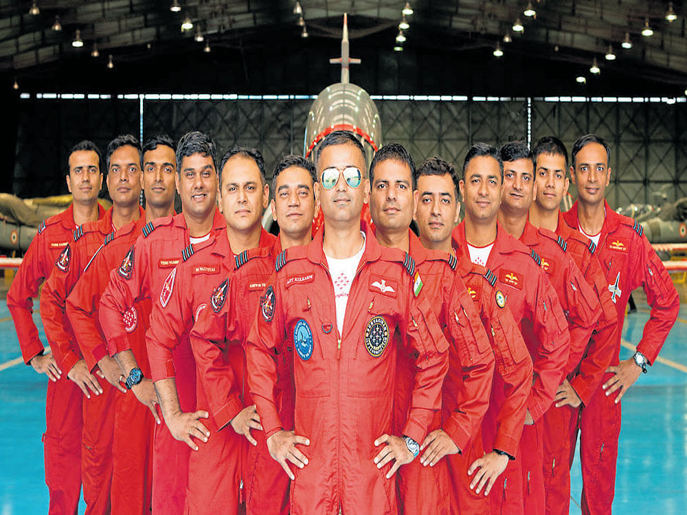 motivated Wing Commander Venu Nambisan (fourth from left) with his Surya Kiran team mates.