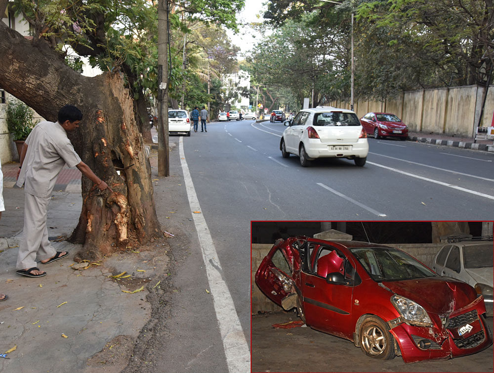 An old tree in front of former minister D B Chandre Gowda's residence in MLA Layout, RT&#8200;Nagar, where a car hit the tree on Monday midnight killing a student and injuring three  others. (Inset) The mangled remains of the car. DH photos