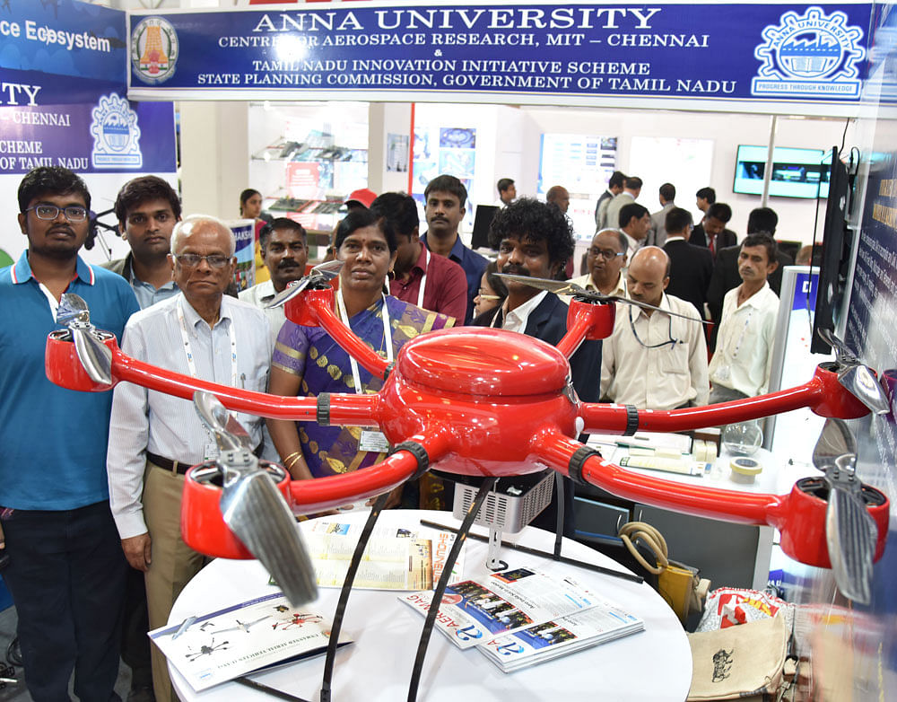 Visitors take a look an unmanned aerial vehicles developed by Anna University. DH photo