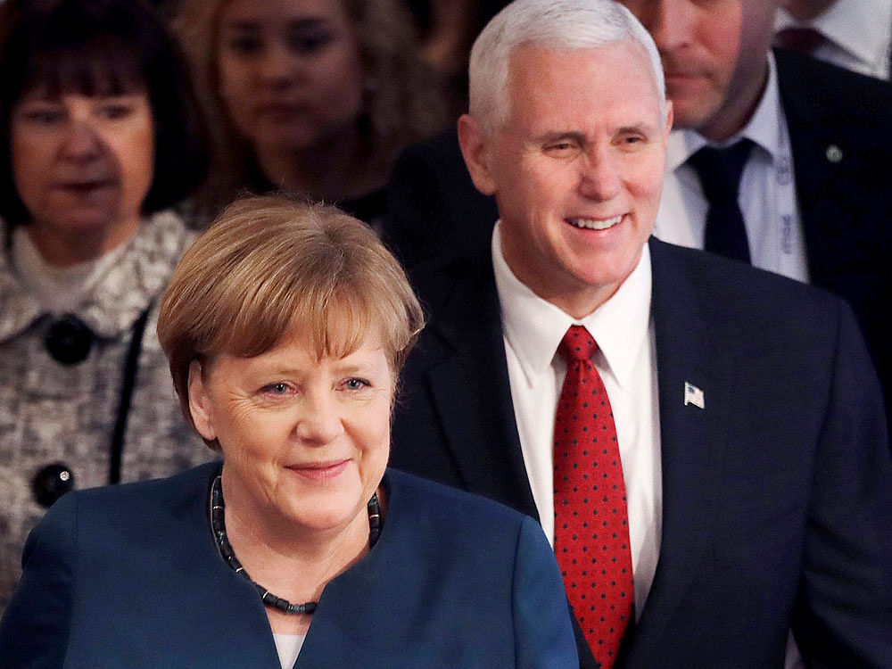 German Chancellor Angela Merkel, left, and United States Vice President Mike Pence arrive at the Munich Security Conference in Munich, Germany, Saturday, Feb. 18, 2017. The annual weekend gathering is known for providing an open and informal platform to meet in close quarters. AP/PTI Photo