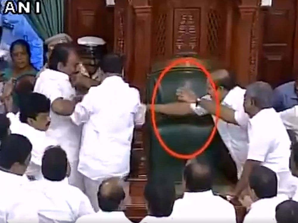 The House turned into a virtual war zone after the Speaker ordered the eviction of DMK members with marshals trying hard to remove them.  ANI Screengrab
