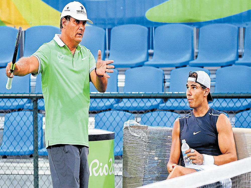 TONI DAYS Toni Nadal (left) has chosen the right time to step away, with Nadal banking more on Carlos Moya. AFP