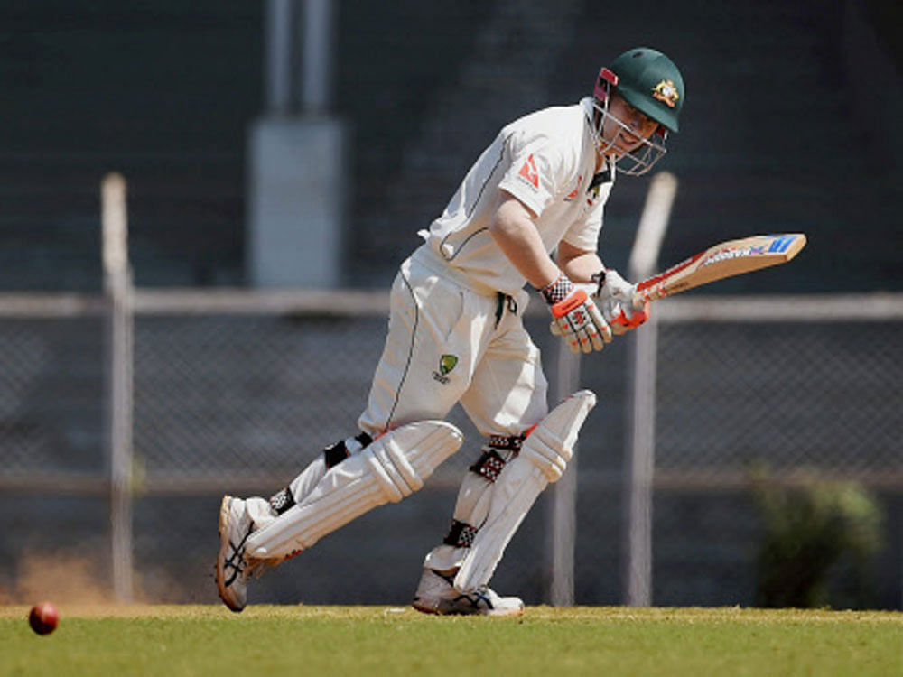 Australian player David Warner in action during a warm-up match against India A at Brabourne Stadium in Mumbai on Sunday. PTI Photo