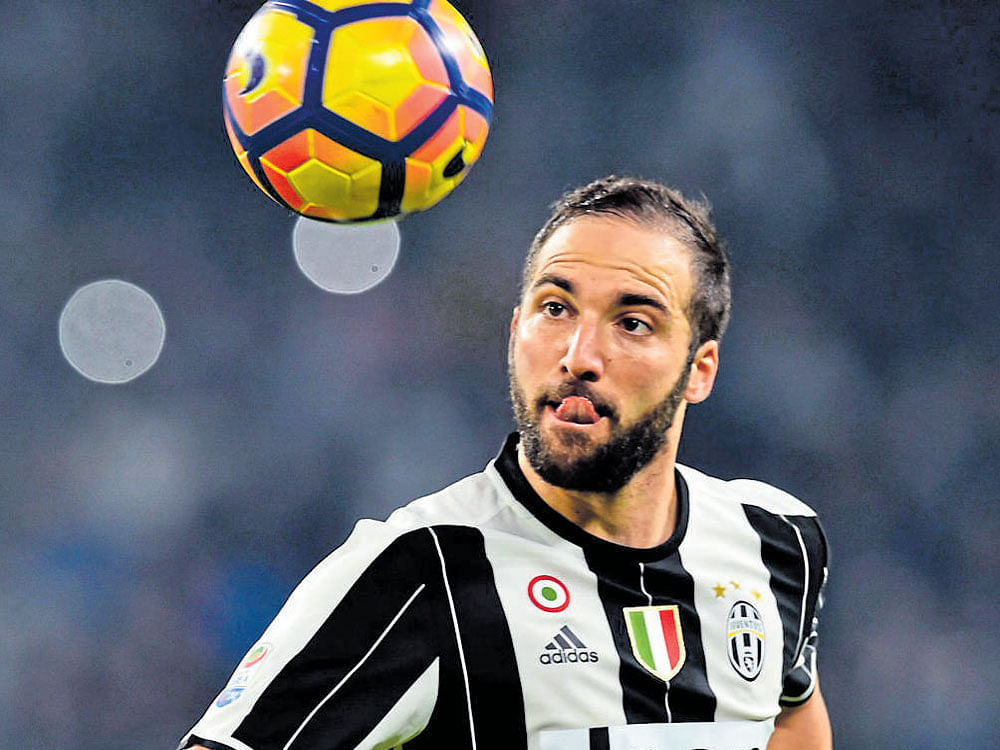 Hitman: Juventus' Argentine striker Gonzalo Higuain will look to continue his prolific scoring form when his side take on FC Porto at the Estadio do Dragao on Wednesday. AFP