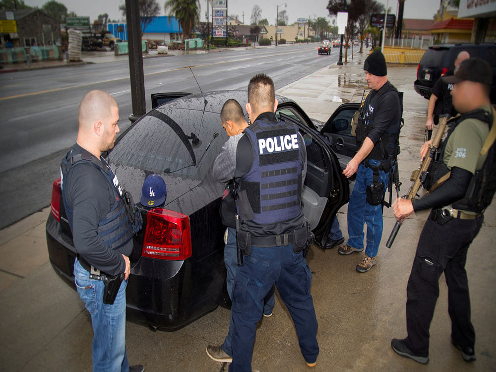 U.S. Immigration and Customs Enforcement (ICE) officers detain a suspect as they conduct a targeted enforcement operation in Los Angeles, California. Reuters photo