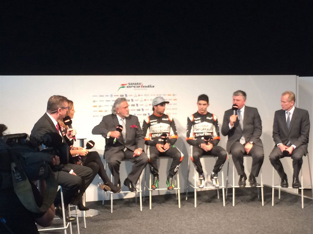 The drivers join Vijay Mallya, COO O Szafnauer and Technical Director Andrew Green on stage. Photo credit: Twitter