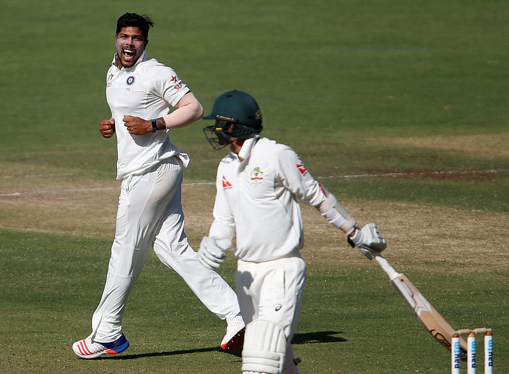 India's Umesh Yadav celebrates the wicket of Australia's Nathan Lyon. REUTERS