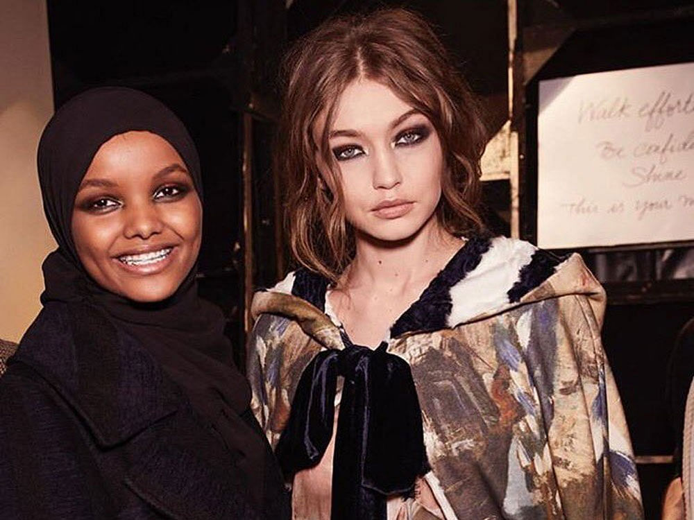 Hijab-wearing model Halima Aden made her Milan debut during Alberta Ferretti's show which also saw fashion sisters Gigi and Bella Hadid on the runway. Image tweeted by @IMGmodels