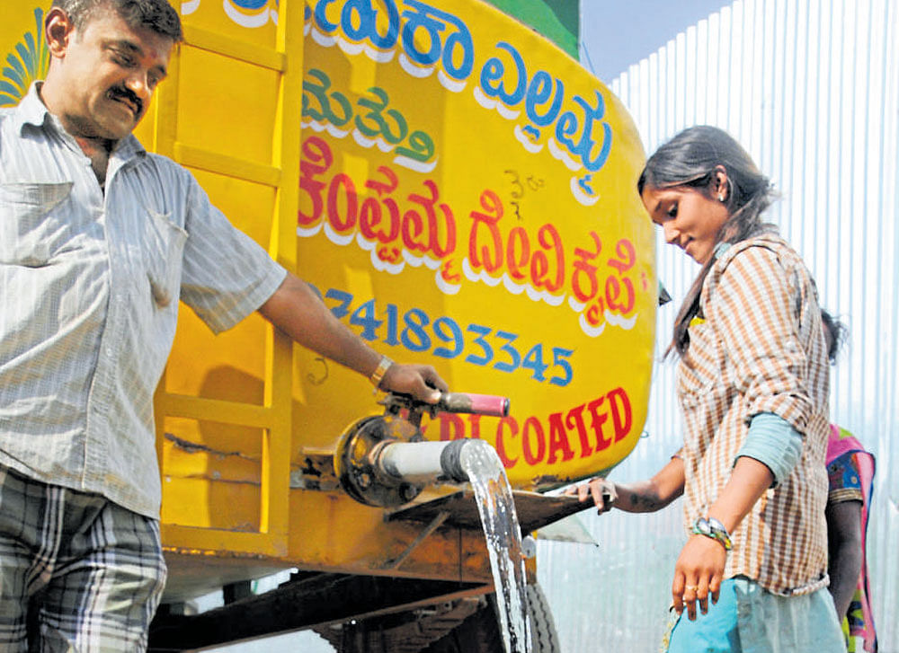 In areas which do not get Cauvery water supply, people are forced to depend on expensive private tankers. dh file photo