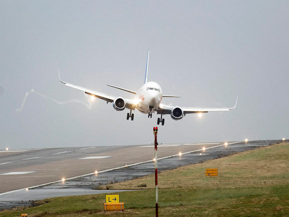 A plane is buffeted by the wind as it comes in to land at Leeds Bradford Airport. Flights were cancelled and commuters were warned that they faced delays as winds reached nearly 90mph when Storm Doris battered many part of Britain. AP/PTI Photo