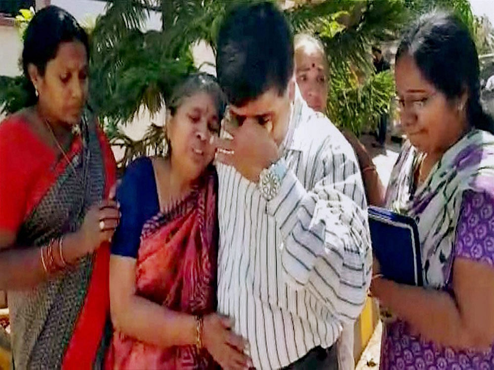 Parents of engineer Srinivas Kuchibhotla mourn his death in Hyderabad on Friday. Kuchibhotla was killed in a shooting at a bar in Kansas in the US. PTI Photo