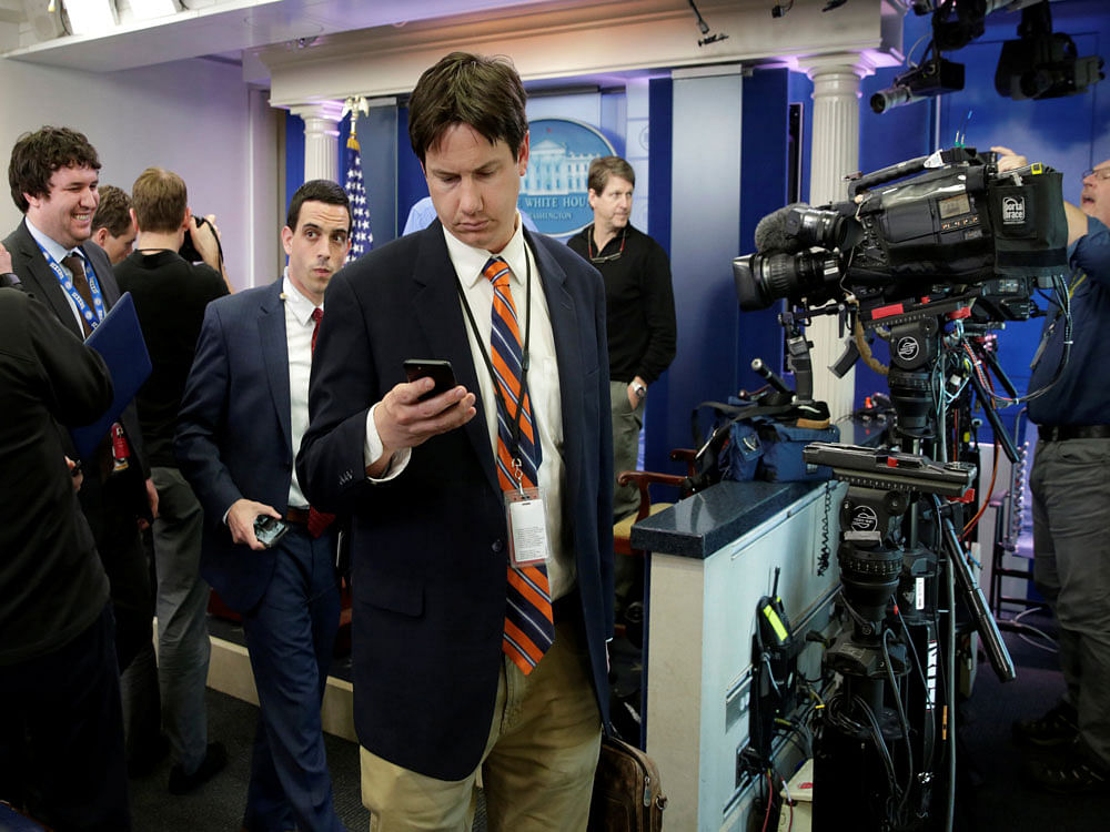 Journalists leave after several major news organizations including CNN, The New York Times and Politico were excluded from an off camera 'gaggle' meeting with White House Press Secretary Sean Spicer in his office that was held in place of the regular daily press briefing at the White House in Washington, U.S., February 24, 2017.  Reuters photo