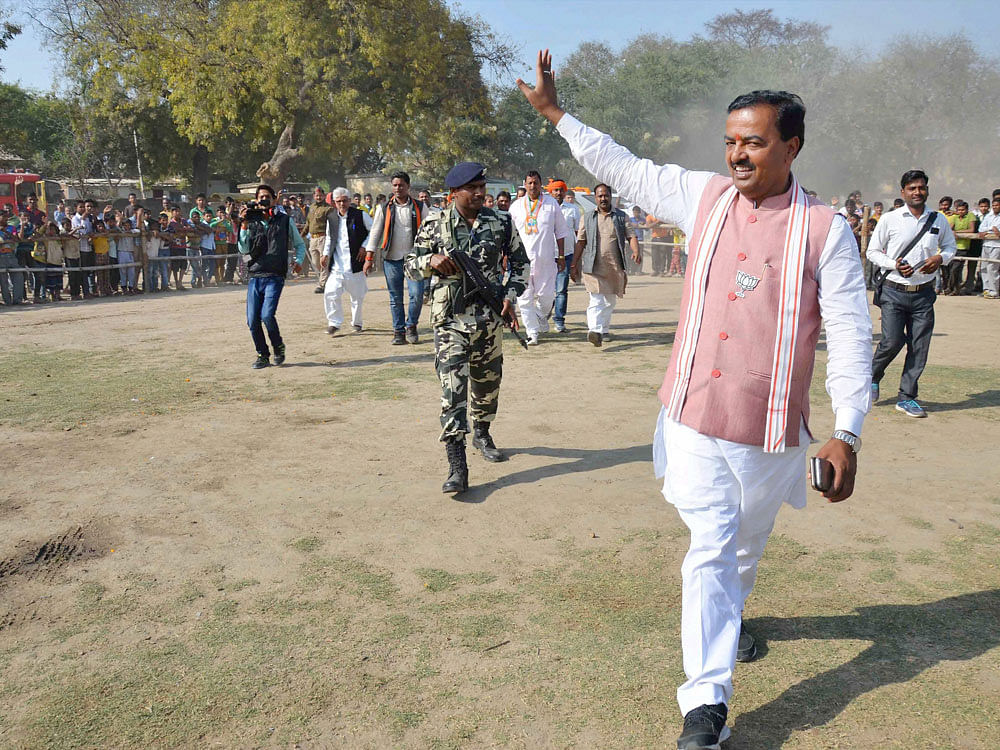 UP BJP President Keshav Prasad Maurya waves at crowd during an election rally in Mirzapur on Thursday. PTI Photo