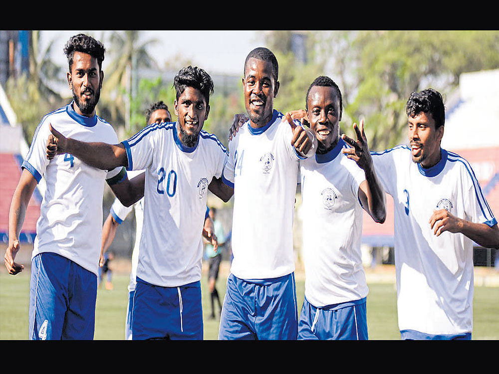 purple patch Students Union striker Emmanuel (third from left) celebrates with              team-mates after scoring against AGORC in the Super Division on Sunday. DH photo
