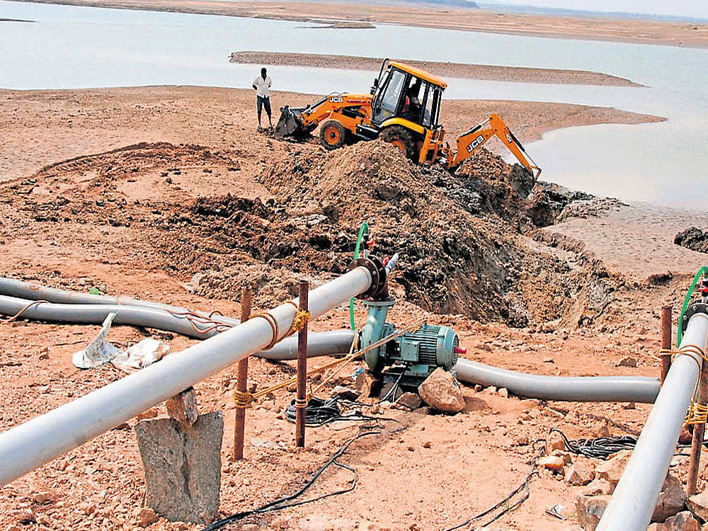 With water level in Hemavathi dam having reached the dead storage level, pipes are being laid in the reservoir to pump water to jackwell. An action plan, at an estimated cost of Rs 1.68 crore, has been prepared for the project tomeet drinking water needs of Hassan. DH photo