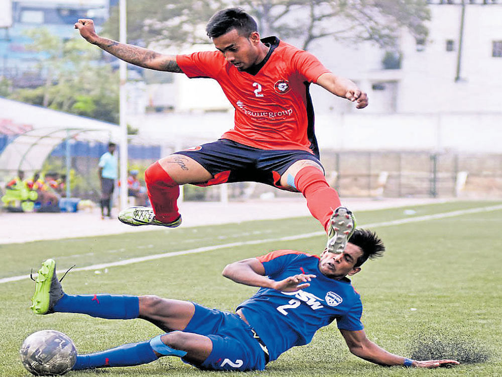 keen tussle Bengaluru FC's Prashanth K (below) tries to tackle Collin Abranches of Ozone FC&#8200;on Monday. DH Photo