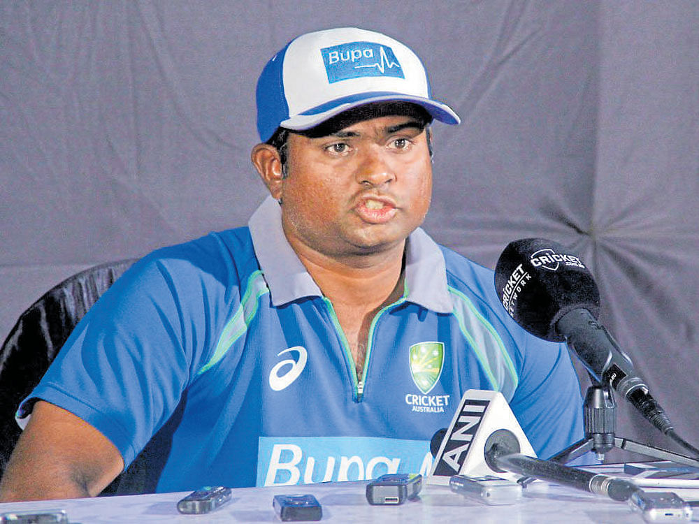 Second innings Australian spin bowling consultant Sridharan Sriram addresses a press conference in Pune on Monday.