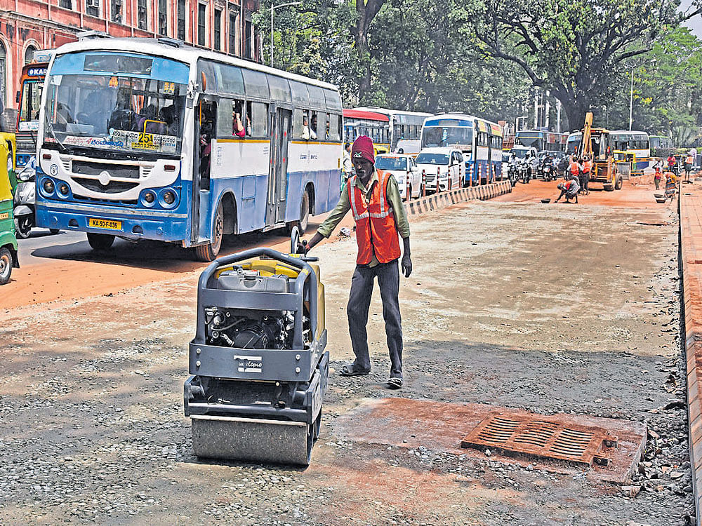 White-topping of Nrupatunga Road in progress. The road will be closed for traffic till the project is completed. DH photo