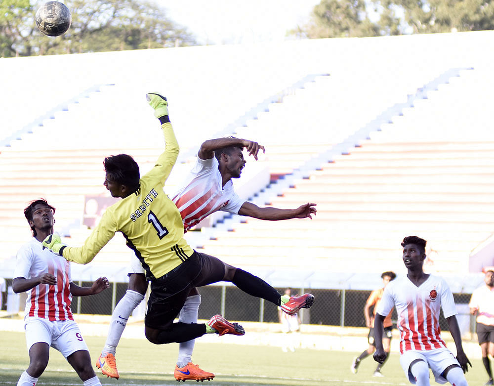 South United Fc Goalkeeper Srijith vie with CIL Fc Diwakar, during their clash in the Super Division Football league, at KSFA stadium in Bengaluru on Tuesday. DH Photo/ B H Shivakumar