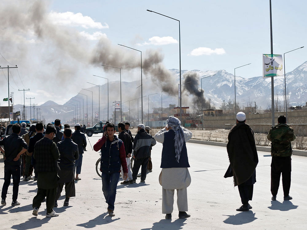 Smoke rises from the site of a blast and gunfire between Taliban and Afghan forces in PD 6 in Kabul, Afghanistan. Reuters Photo.