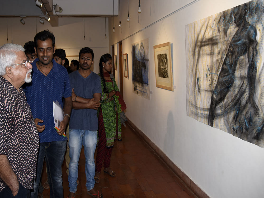 INTRICATE WORKS: Artist Kiran Rajashekar with S G Vasudev.