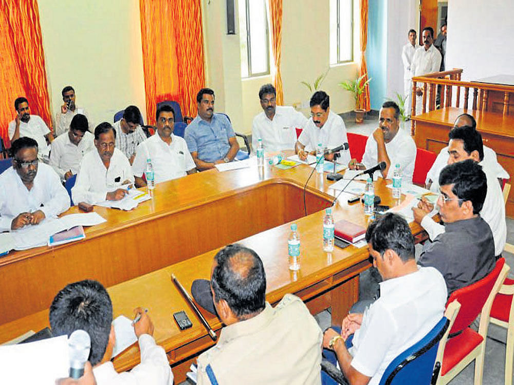 Food and Civil Supplies and District in-charge Minister U T Khader chairs a meeting of officials in Chamarajanagar on Friday.