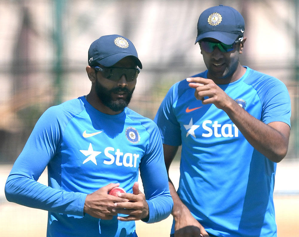 When will it turn?: Indian spinners Ravindra Jadeja (left) and Ravichandran Ashwin discuss tactics on the eve of the second Test against Australia. DH photo/ Kishor Kumar Bolar