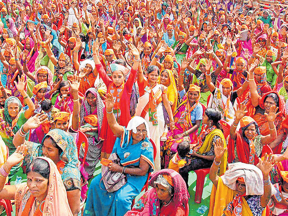 Prime Minister Narendra Modi's supporters at a campaign rally in Mirzapur on Friday. PTI