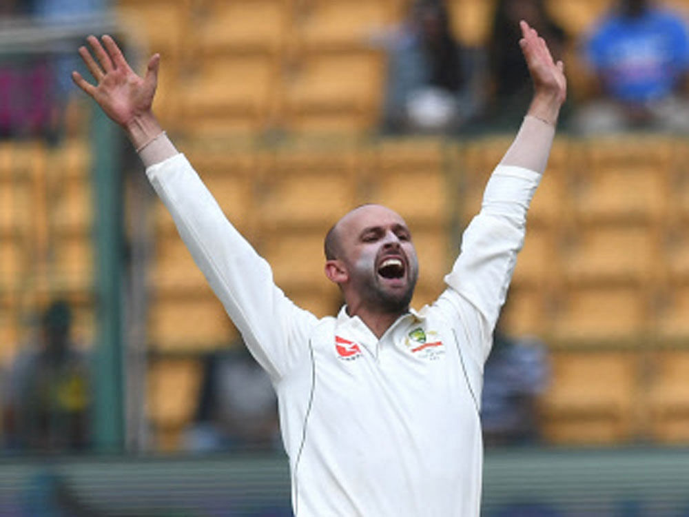 Australian bowler Nathan Lyon appeal for the wicket of Indian captain Virat Kohli as he claimed 8 wickets at 2nd Test match in Chinnaswami Stadium in Bengaluru on Saturday. DH Photo.