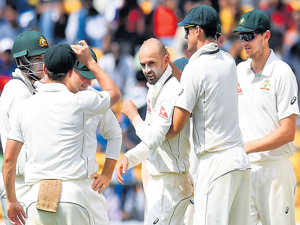 wrecker-in-chief: Australia's Nathan Lyon (centre) celebrates with team-mates after dismissing R&#8200;Ashiwn of India. DH Photos/ Kishor Kumar Bolar