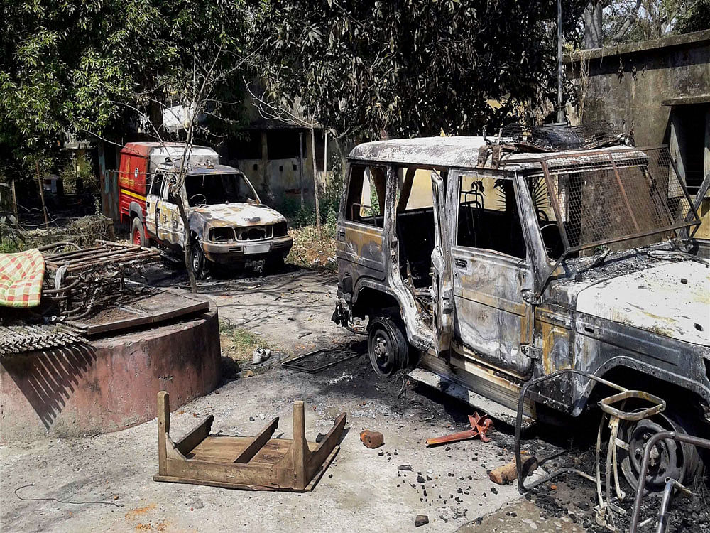 A jeep burnt allegedly by mob in Barhara police station in Ara, Bihar on Sunday. PTI Photo