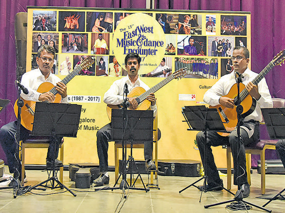 musical feast The 'Madras Guitar Quintet' in performance.