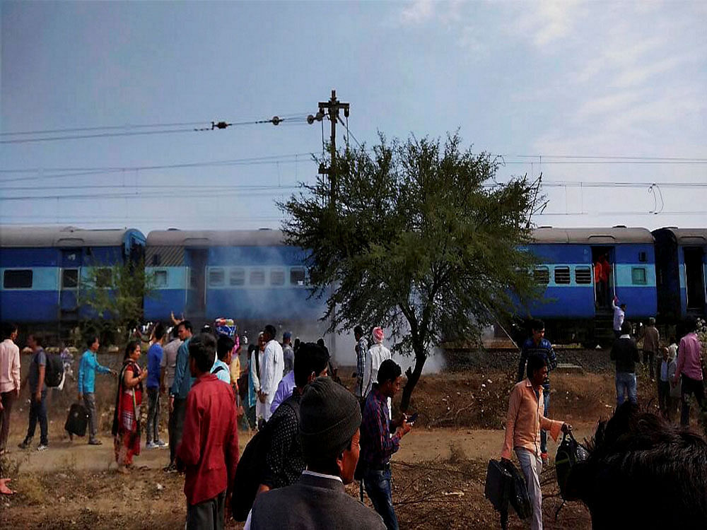 Smoke erupts from a bogie after a blast in the Bhopal-Ujjain passenger train near Jabdi station in Shajapur district in Madhya Pradesh. Speaking in Madhya Pradesh Assembly, Chief Minister Shivraj Singh Chouhan said that those who orchestrated the blast arrived from Lucknow and planted the bomb in the passenger train as part of a 'pre-planned conspiracy'. PTI photo