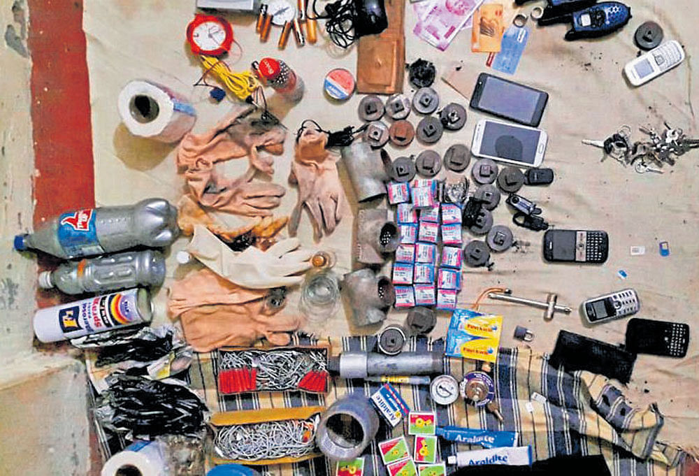 Arms, ammunition and other items recovered after suspected IS terrorist Saifullah was killed in a 12-hour long operation by an ATS team on the outskirts of Lucknow on Wednesday. PTI