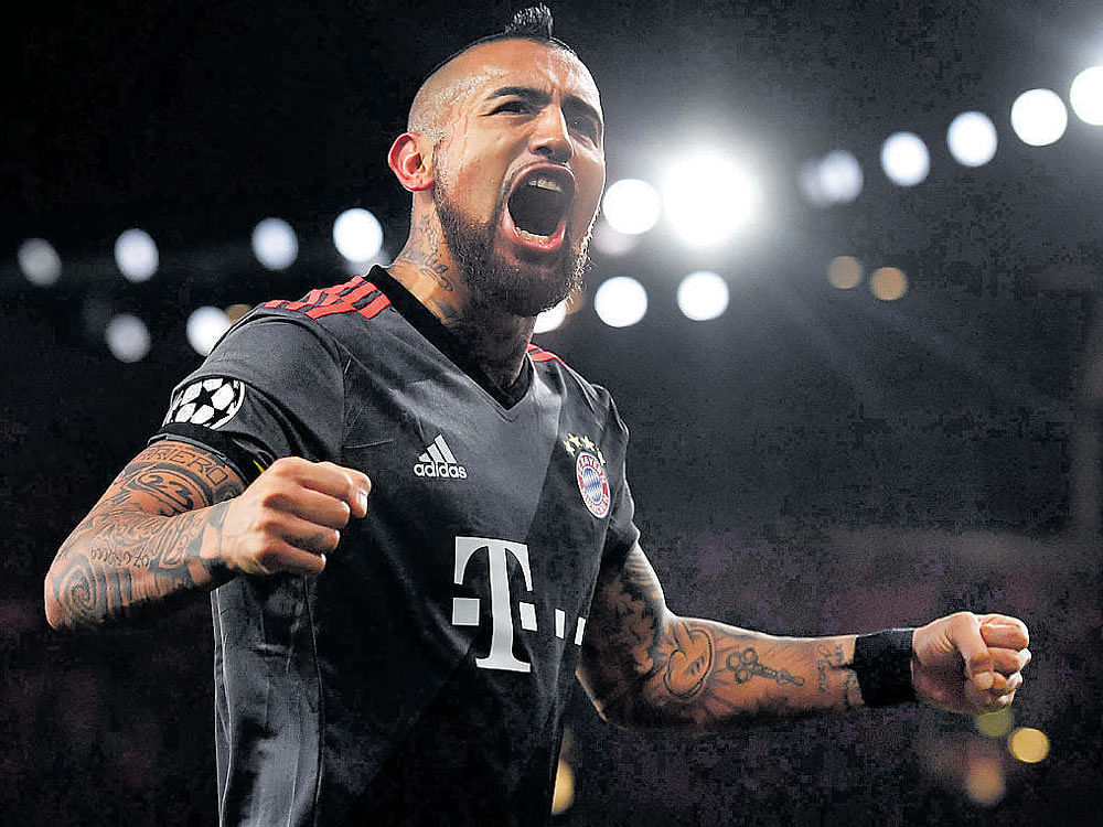 red hot chilean Bayern Munich's Arturo Vidal celebrates after scoring against Arsenal in the second leg of the Champions League last-16 tie on Tuesday night. afp