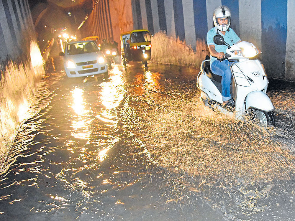 TOUGH RIDE The recent rains have caused waterlogging in several parts of the city.  DH PHOTOS BY B K JANARDHAN