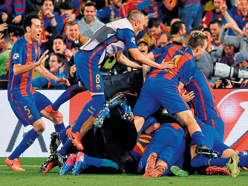 unbelievable: Barcelona players celebrate their win over Paris St Germain in the last-16 at Nou Camp on Wednesday. AFP